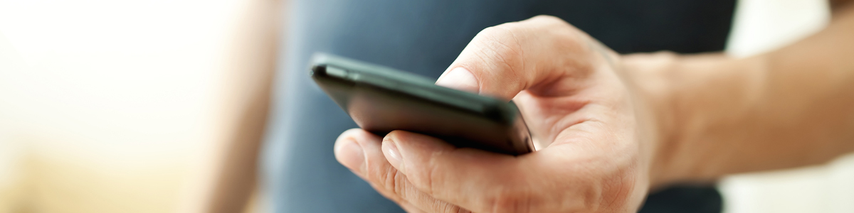 person holding mobile phone using an app